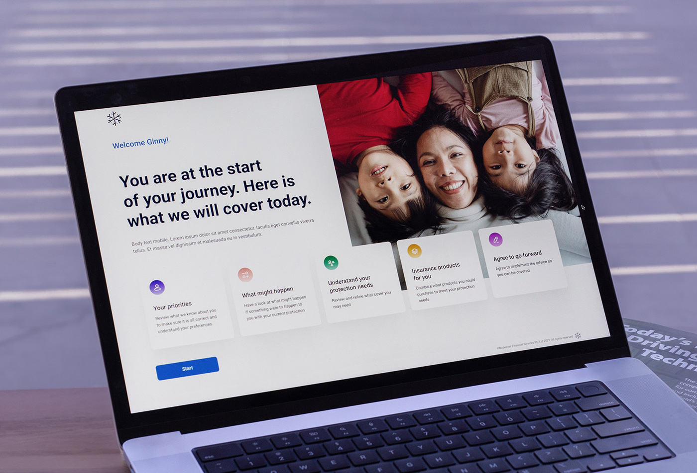 A closeup of a laptop on a desk, displaying the welcome page of an insurance journey. The screen outlines the four steps of the journey, providing a clear and inviting introduction for users.