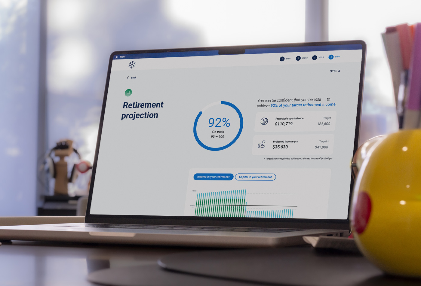 A closeup of a laptop showing the results screen of the retirement journey with the score.